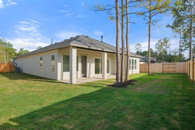 16006 Ruby Laurel Ct, Conroe, TX 77302 - rear view of property featuring cooling unit, stucco siding, and a patio area