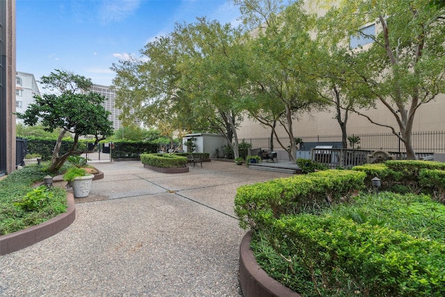 view of home's community with a patio area