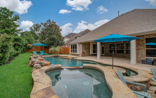 view of swimming pool with an in ground hot tub and a patio