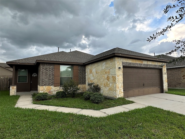 view of front facade featuring a garage and a front lawn