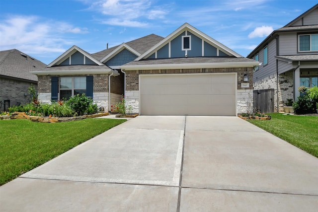 view of front of house featuring a front yard and a garage