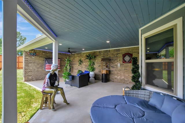 view of patio with an outdoor living space and ceiling fan