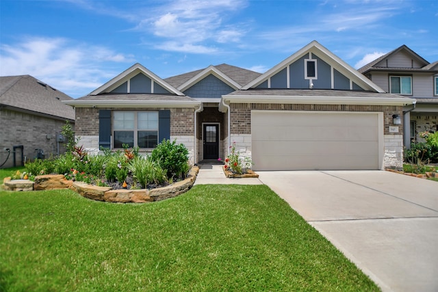 view of front of property featuring a garage and a front lawn