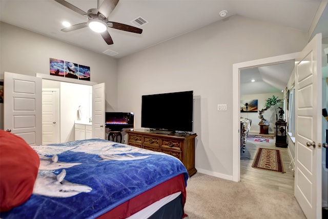 bedroom with lofted ceiling, light carpet, and ceiling fan