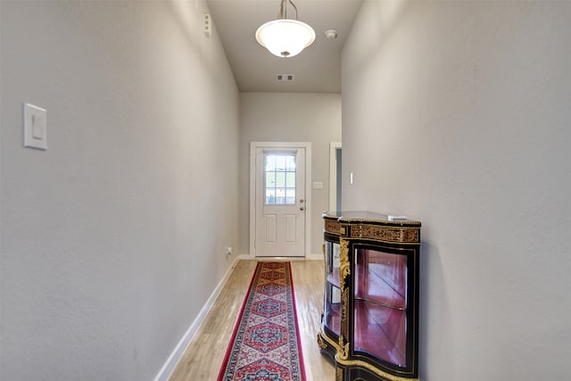 doorway to outside with hardwood / wood-style flooring