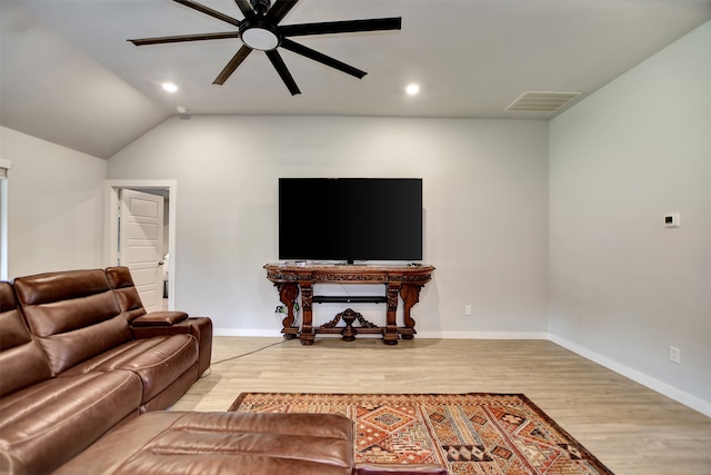 living room featuring vaulted ceiling, ceiling fan, and hardwood / wood-style floors