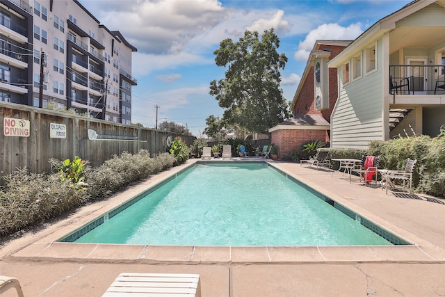 view of pool featuring a patio