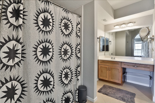 bathroom with tile patterned flooring, vanity, and a shower with shower curtain