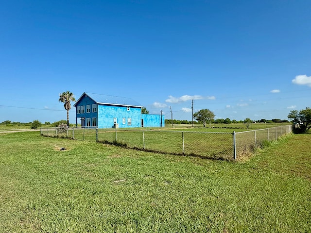 view of yard with a rural view