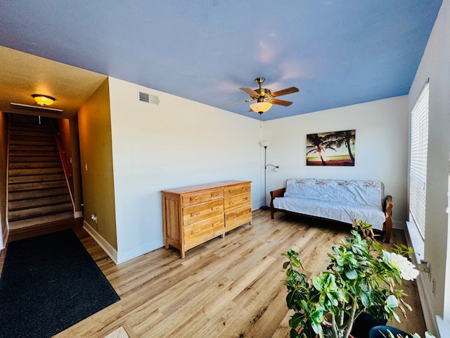 bedroom featuring ceiling fan and light wood-type flooring