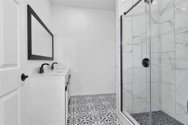 bathroom with vanity, tile patterned flooring, and an enclosed shower