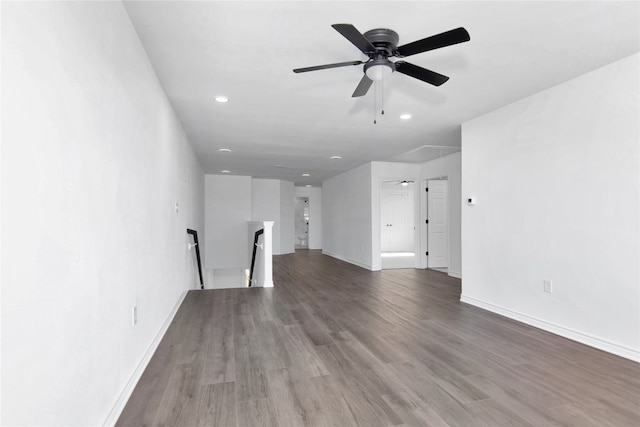 empty room with ceiling fan and hardwood / wood-style floors