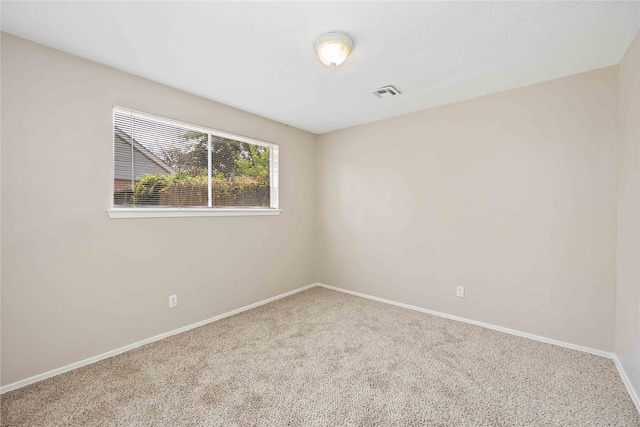 unfurnished room featuring carpet