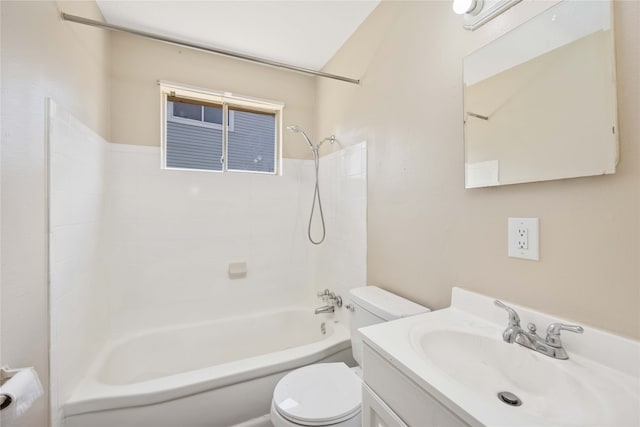 full bathroom featuring tiled shower / bath combo, toilet, and vanity