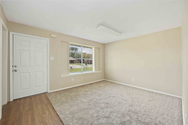 empty room featuring hardwood / wood-style flooring