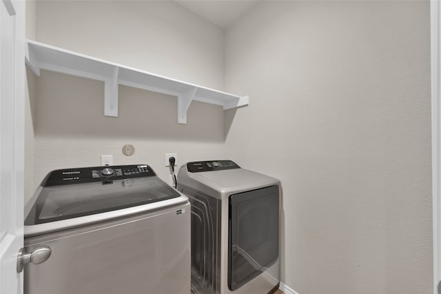 washroom featuring independent washer and dryer