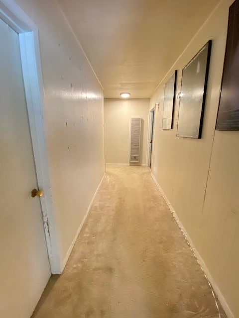 hallway with light colored carpet