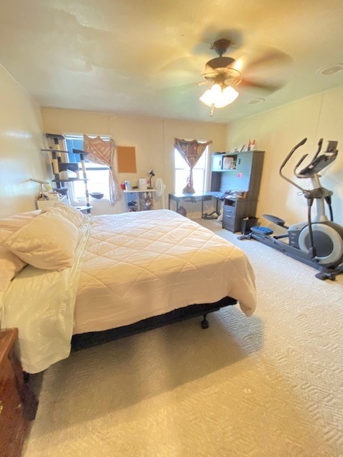 bedroom featuring ceiling fan and carpet flooring