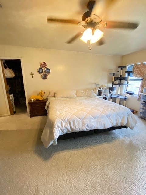 carpeted bedroom featuring ceiling fan