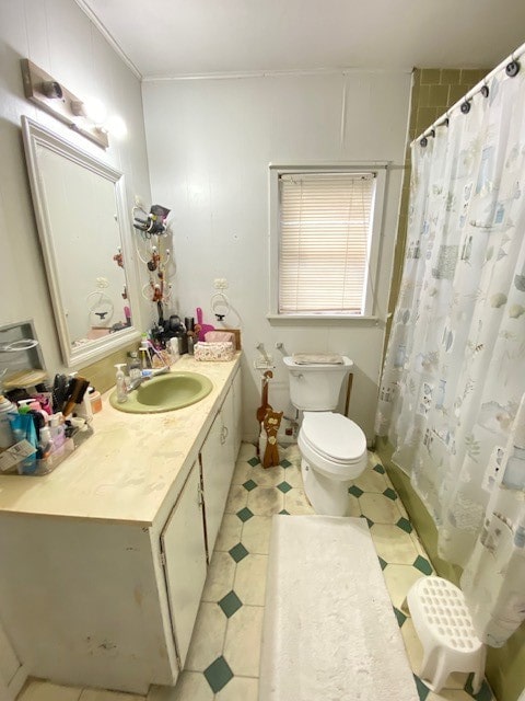 bathroom with a shower with shower curtain, tile patterned floors, toilet, and vanity