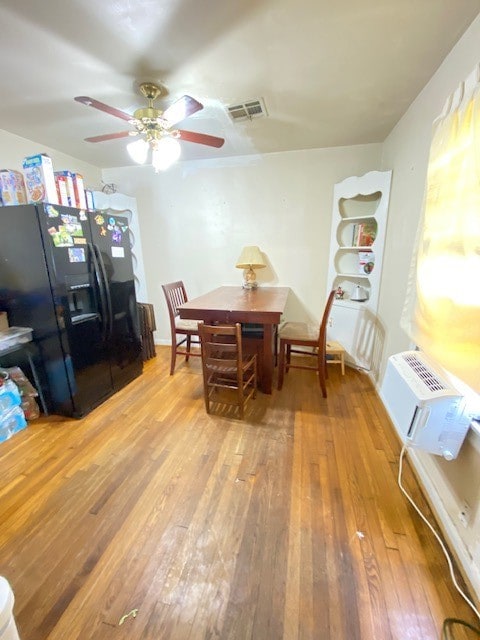 dining room featuring ceiling fan and light hardwood / wood-style flooring