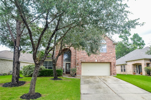 view of front of house with a garage and a front lawn