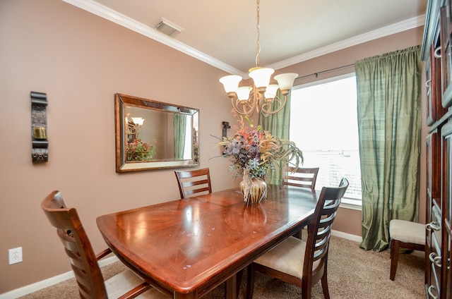 dining room with carpet, ornamental molding, and a notable chandelier