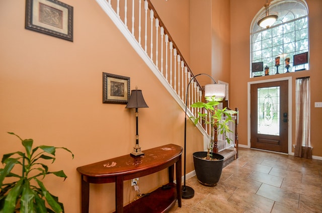 entryway with a towering ceiling