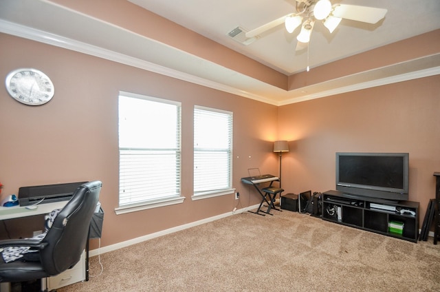 carpeted home office featuring ceiling fan and crown molding