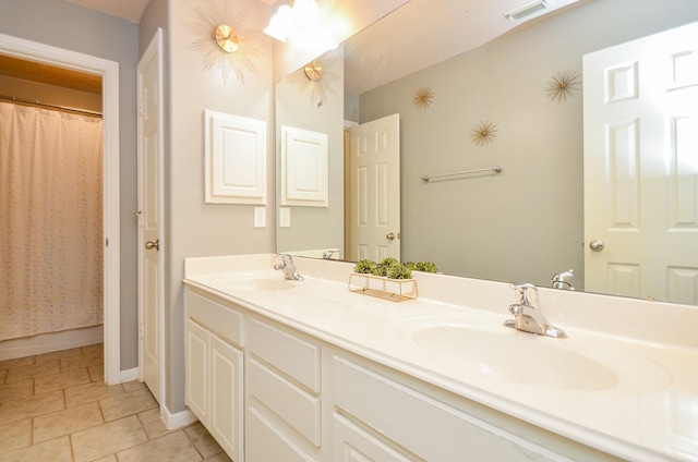 bathroom featuring tile patterned floors, vanity, and a shower with shower curtain