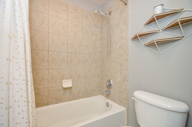 bathroom featuring shower / bath combo and toilet