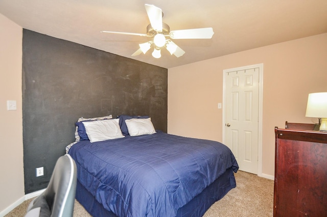 bedroom with light carpet and ceiling fan