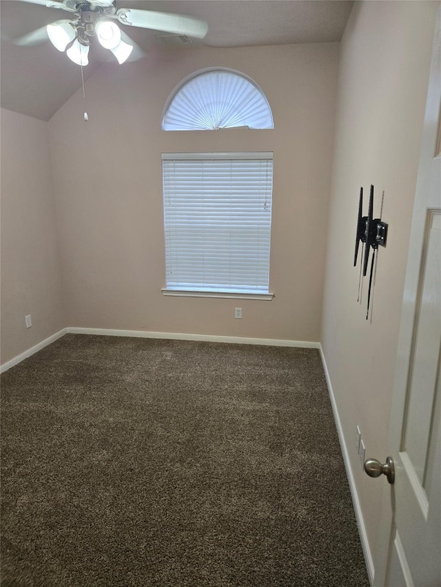 spare room with carpet, ceiling fan, and lofted ceiling