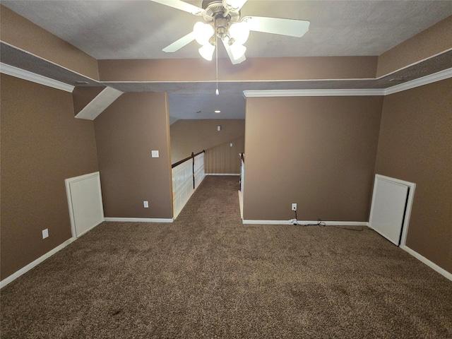 additional living space featuring carpet, a textured ceiling, ceiling fan, and lofted ceiling