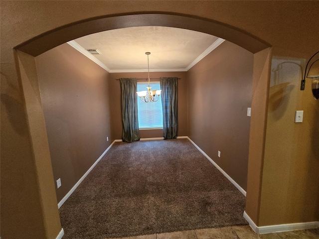 unfurnished dining area with carpet flooring, ornamental molding, and an inviting chandelier