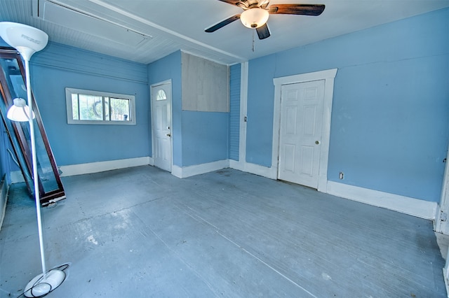 spare room with concrete flooring and ceiling fan