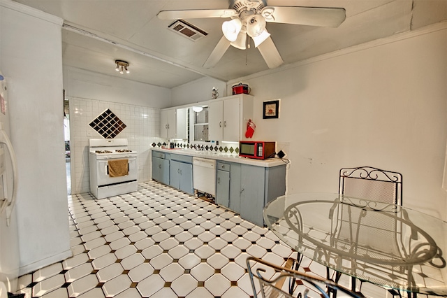 kitchen with ceiling fan, tile walls, white appliances, ornamental molding, and light tile patterned floors