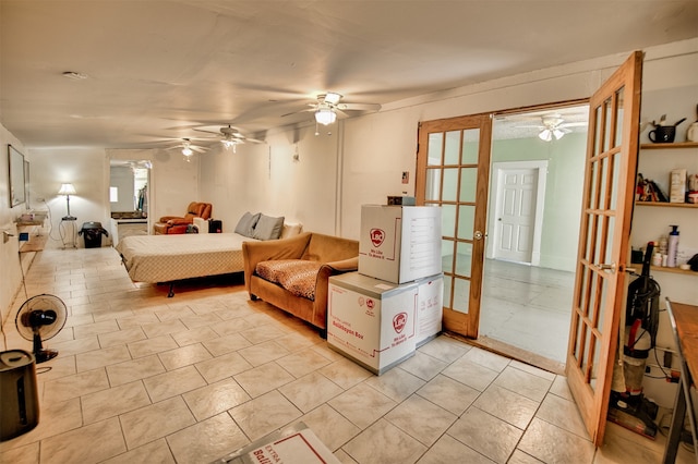 tiled living room featuring french doors and ceiling fan