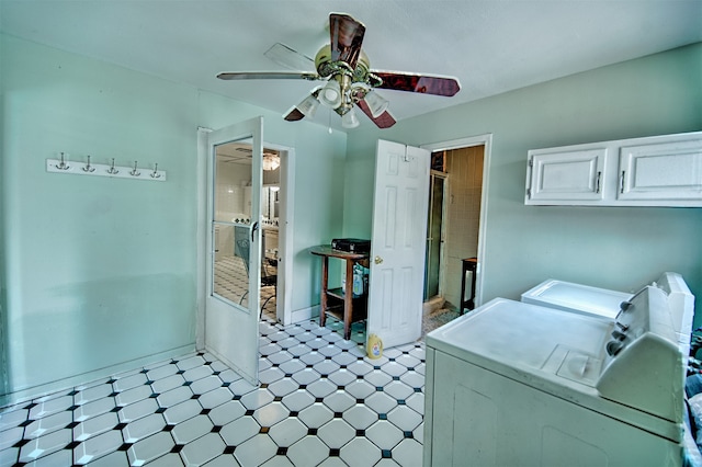 laundry room featuring light tile patterned flooring, washing machine and dryer, ceiling fan, and cabinets