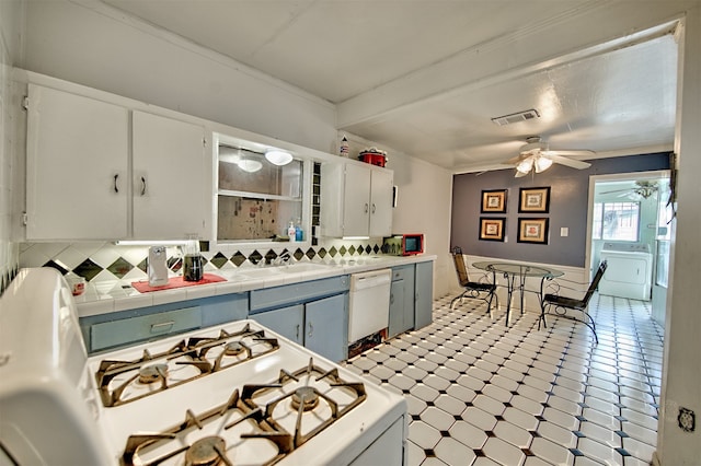 kitchen with tile counters, light tile patterned floors, white dishwasher, ceiling fan, and decorative backsplash