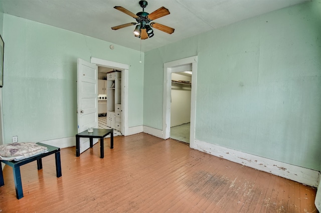 unfurnished room featuring hardwood / wood-style flooring and ceiling fan