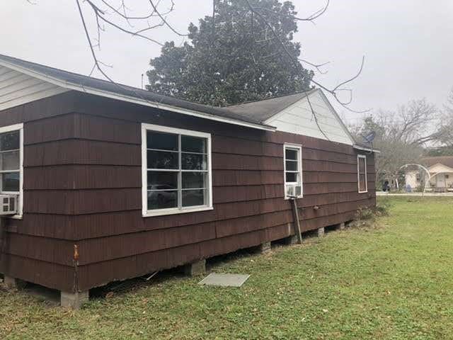 view of property exterior with a yard