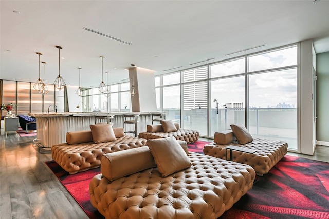 living room with a chandelier and hardwood / wood-style flooring