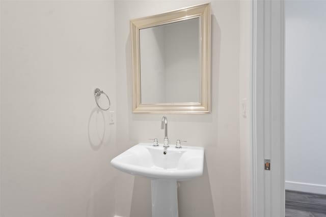 bathroom featuring sink and hardwood / wood-style floors