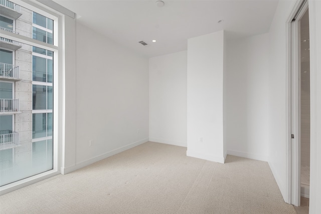 empty room with light colored carpet