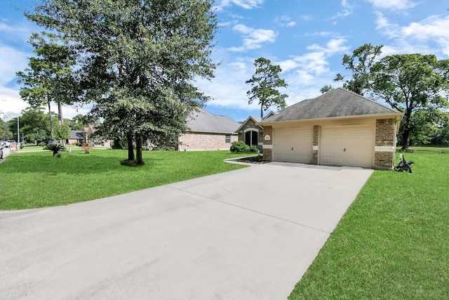 view of side of property with a lawn and a garage