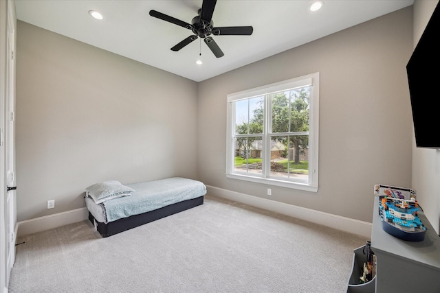 carpeted bedroom with ceiling fan