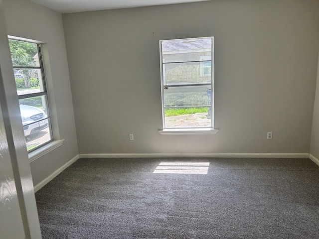 unfurnished room featuring carpet