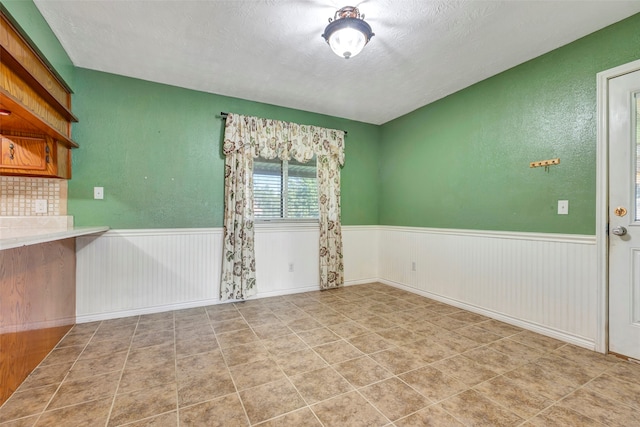 empty room with a textured ceiling