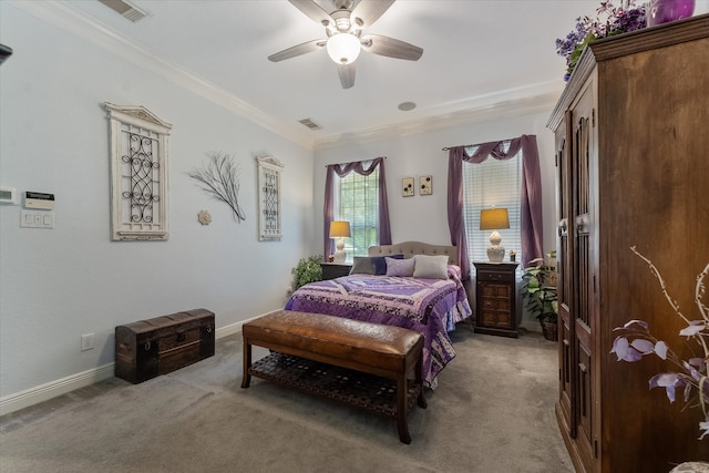 carpeted bedroom featuring ceiling fan and ornamental molding